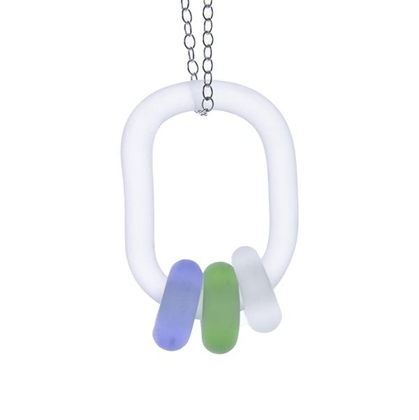 Close up of frosted glass link passing through 3 frosted beads. The beads are blue, clear and green. The link hangs on a sterling silver chain. White background.