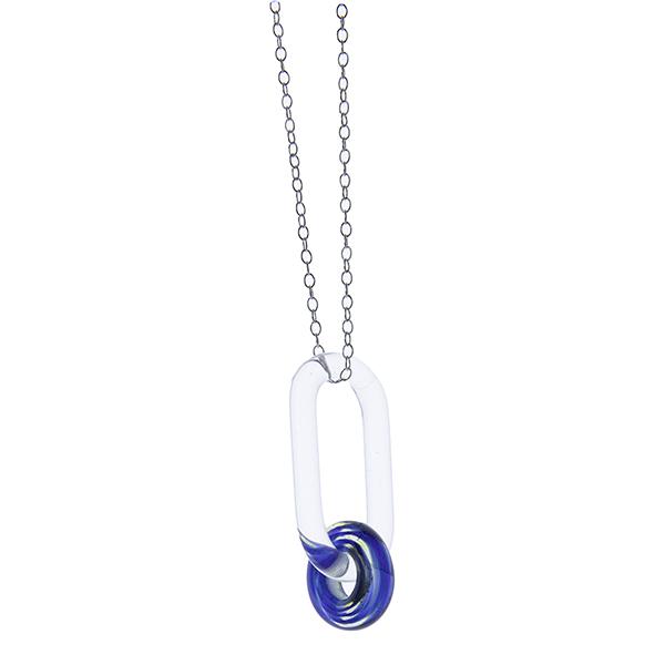 clear glass link passing through swirly blue glass bead, hanging in front of a white background.