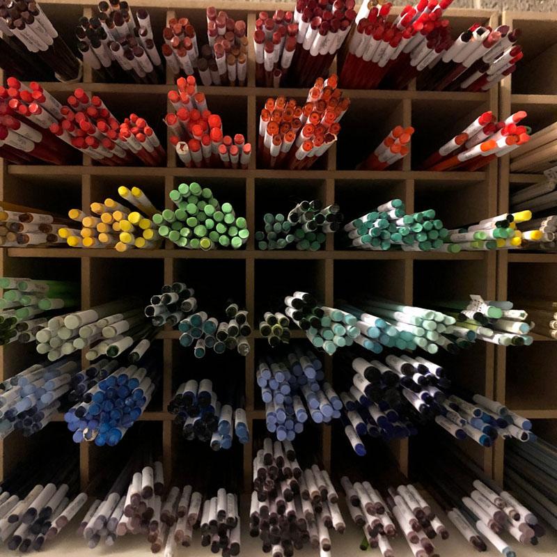 glass rods in a storage cube, sorted by colour