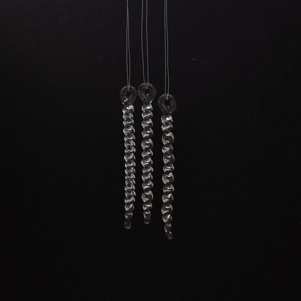 12 tiny clear glass icicles with hanging loop and twist design. The icicles hand in front of a black background.