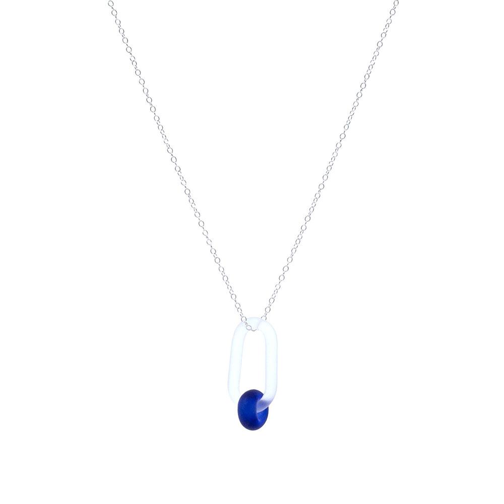 A clear glass link which passes through a bead made from a deep blue sherry bottle. Link and bead have a frosted finish. The link hangs from a fine sterling silver chain.