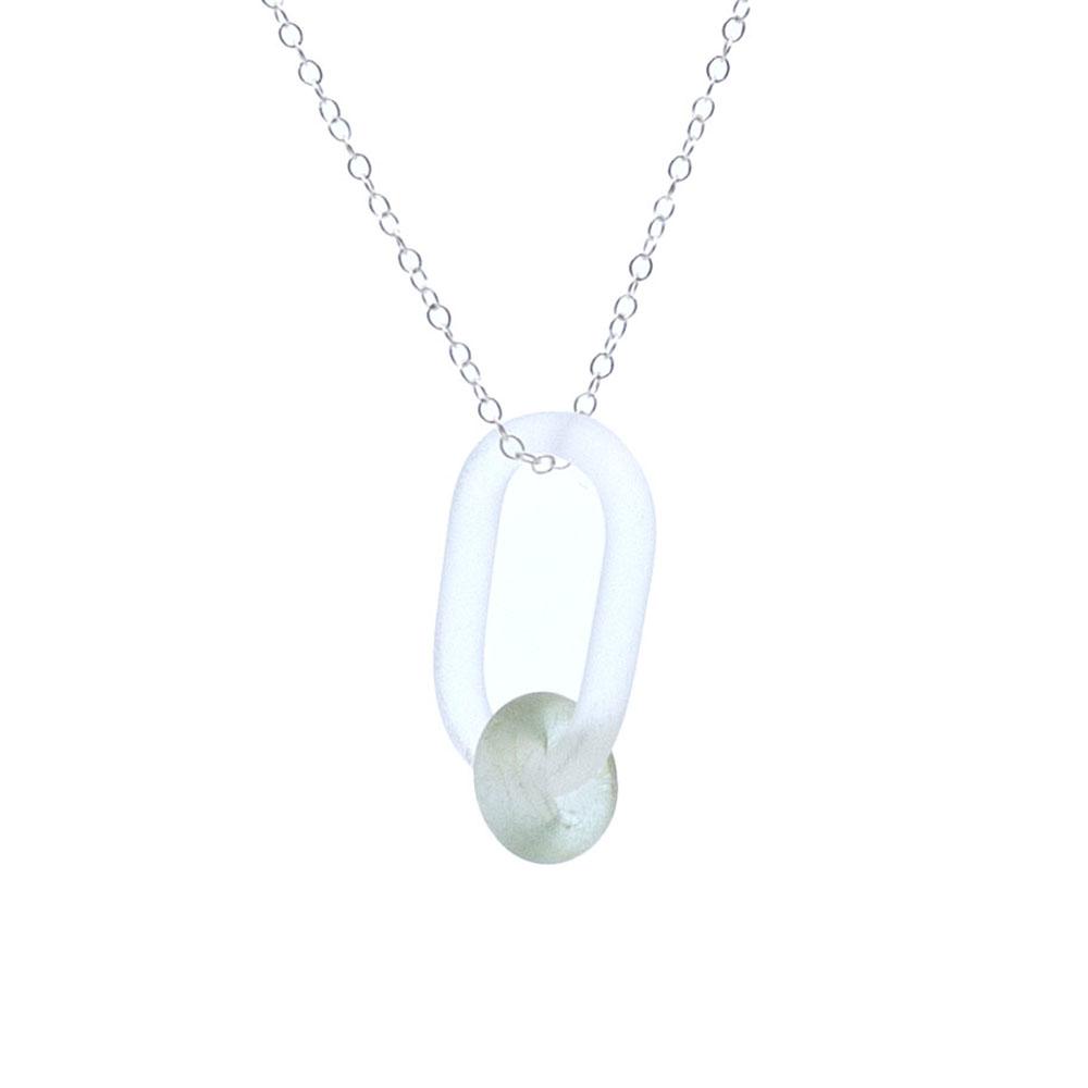 Close up view. A clear glass link which passes through a bead made from a pale green wine bottle. Link and bead have a frosted finish. The link hangs from a fine sterling silver chain.