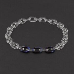 Clear and frosted link chain with three purple and blue Dragon Eye links sitting on a dark background.