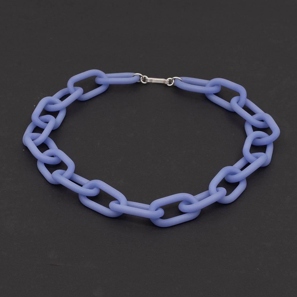 Frosted blue glass chain with a silver hook clasp sitting on a dark background.