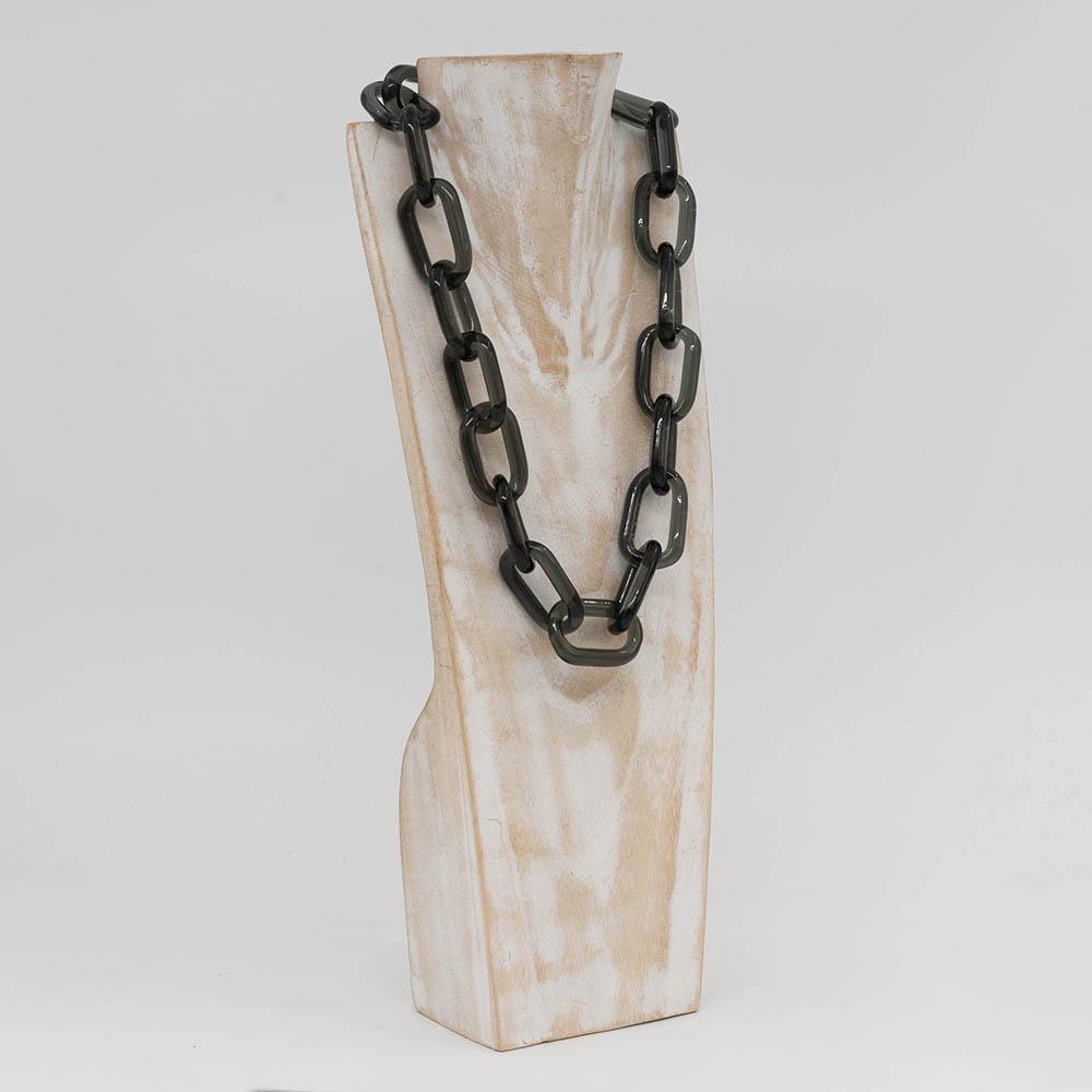 Transparent black glass chain link necklace with a sterling silver hook and loop catch. The necklace hangs on a whitewashed wooden torso which faces sideways.