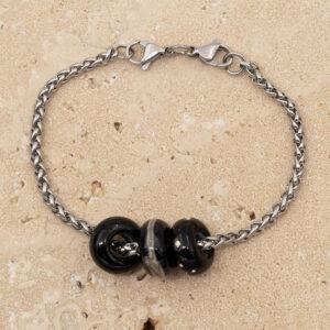 3 shiny black glass beads with big holes on a stainless steel chain bracelet with double lobster clasp fastening.
