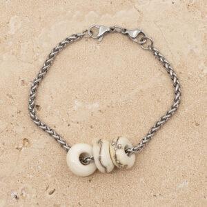 3 shiny ivory glass beads with big holes on a stainless steel chain bracelet with double lobster clasp fastening.