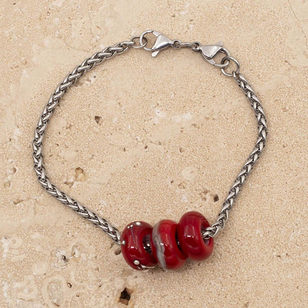 3 shiny red glass beads with big holes on a stainless steel chain bracelet with double lobster claps fastening.