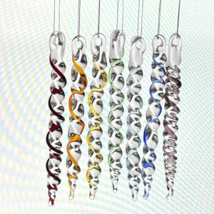 Seven lampwork glass icicles with coloured spirals