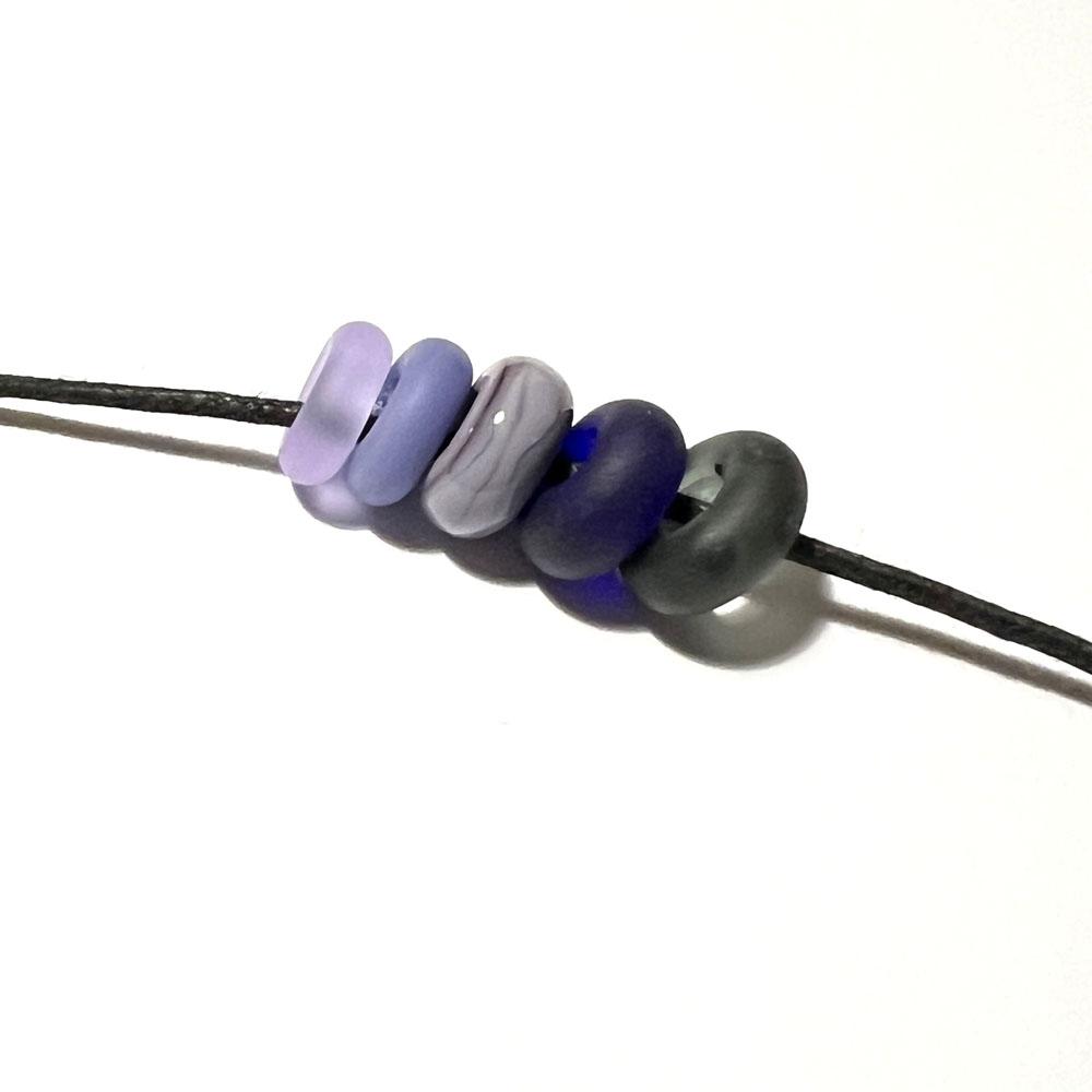 five big holes beads in purples, blue and greys