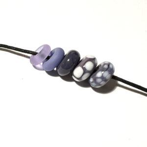 five big holes beads in assorted purples